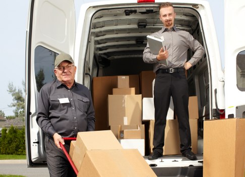Local man and van moving boxes in a Putney residential street
