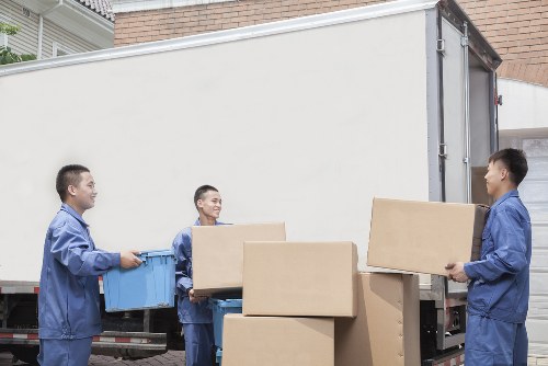 Professional Movers in Putney loading items safely into a vehicle