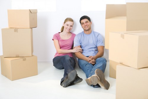 Moving team loading household items for house removals in Putney