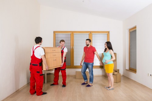 Specialist team preparing an upright piano move in Putney