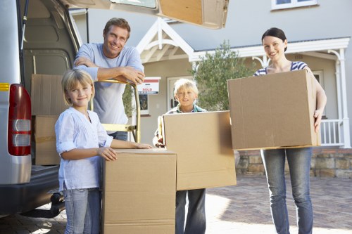 Packed moving boxes and furniture ready for house removals in Putney
