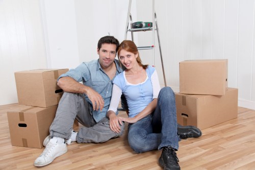 Removal team handling household furniture for a Putney move