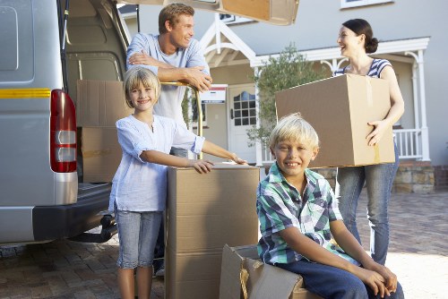 Packed boxes and furniture prepared for student relocation in Putney