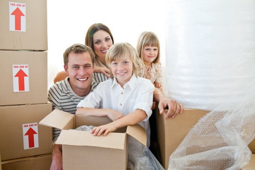 Moving crew handling packed items with care during transit