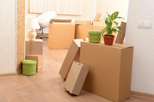 Moving team handling furniture in a Putney property