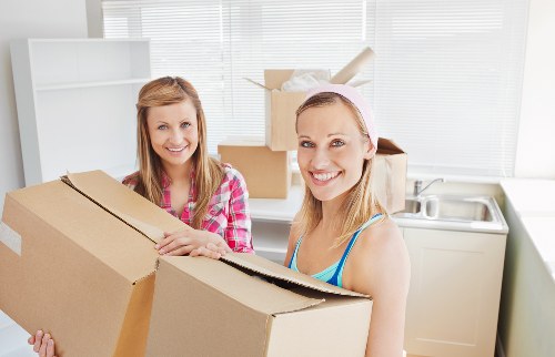 Removalists loading household items for a Putney home move
