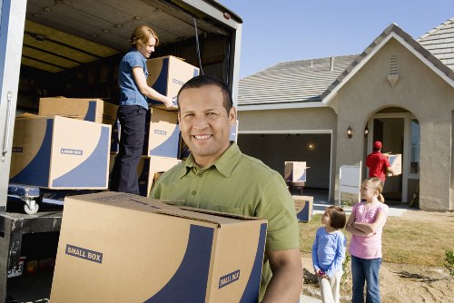 Putney removal service handling packed boxes in a residential move