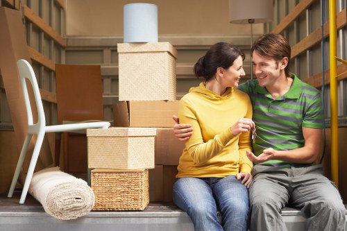 Packed moving boxes and household items ready for a flat move in Putney
